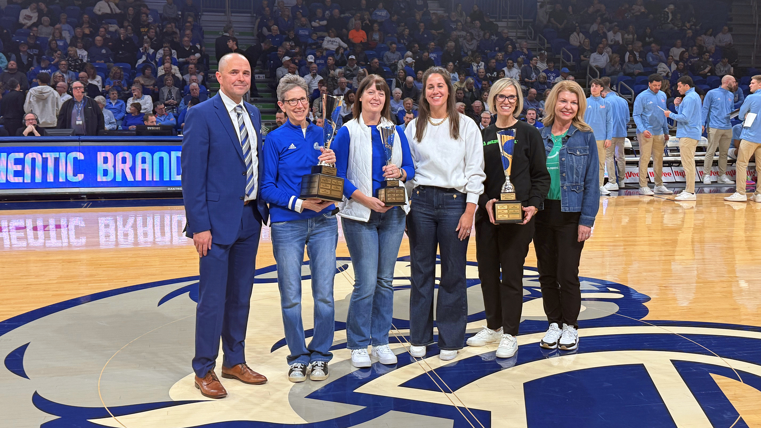ZLR Ignition receiving the award for the Drake Relays Wellness Challenge at center court of the Knapp Center.